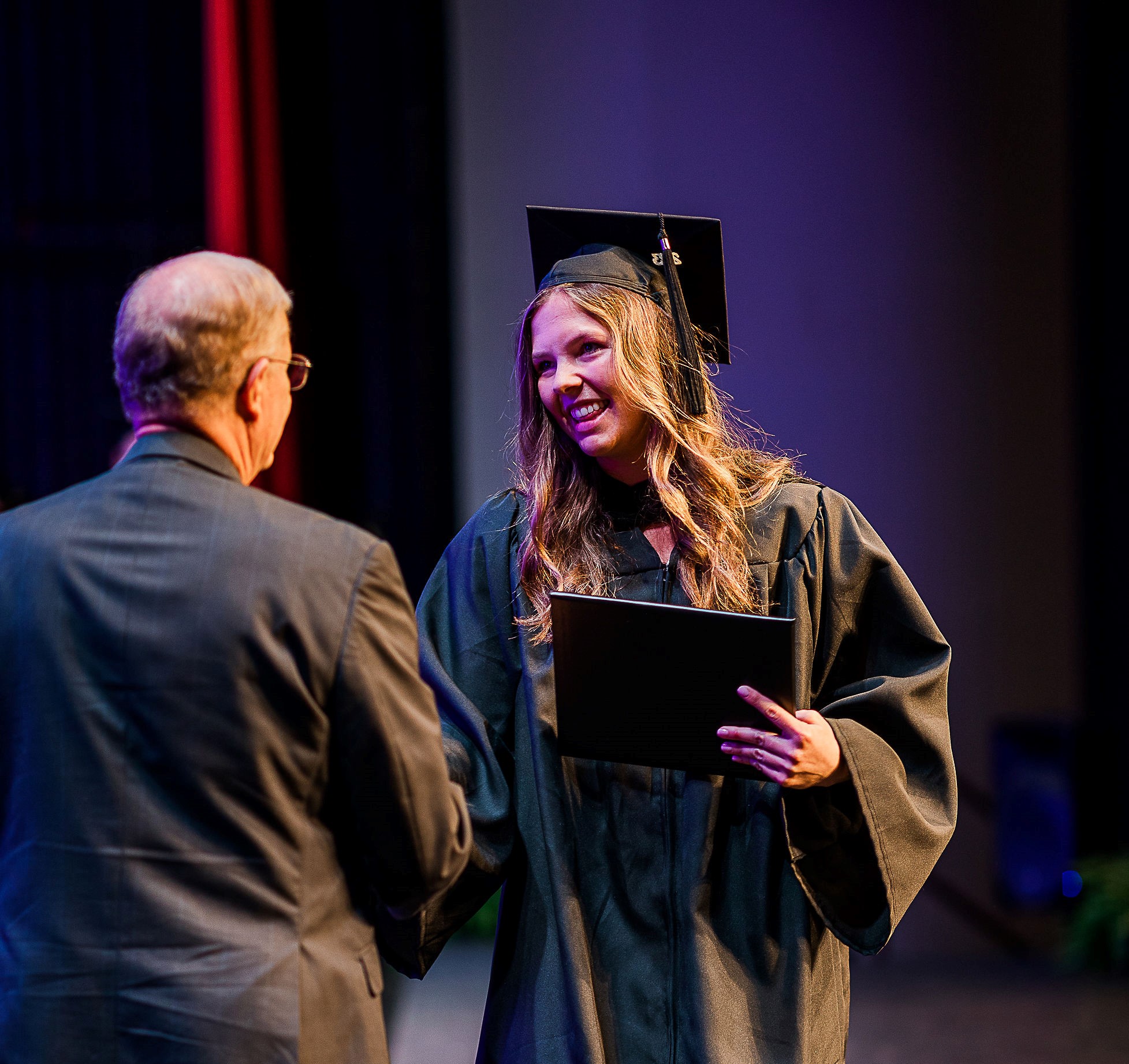 Graduate recieving diploma