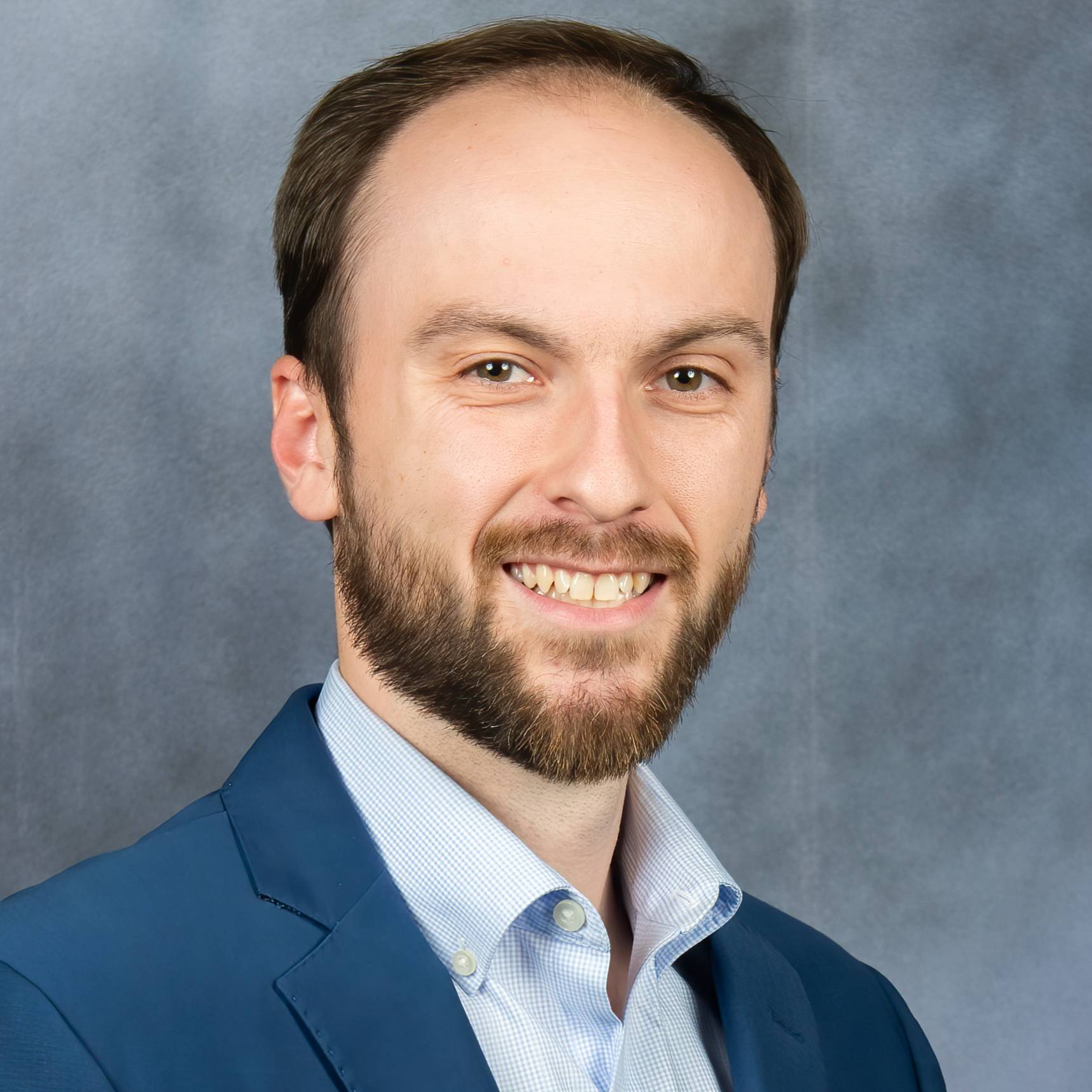 man smiling for headshot photo