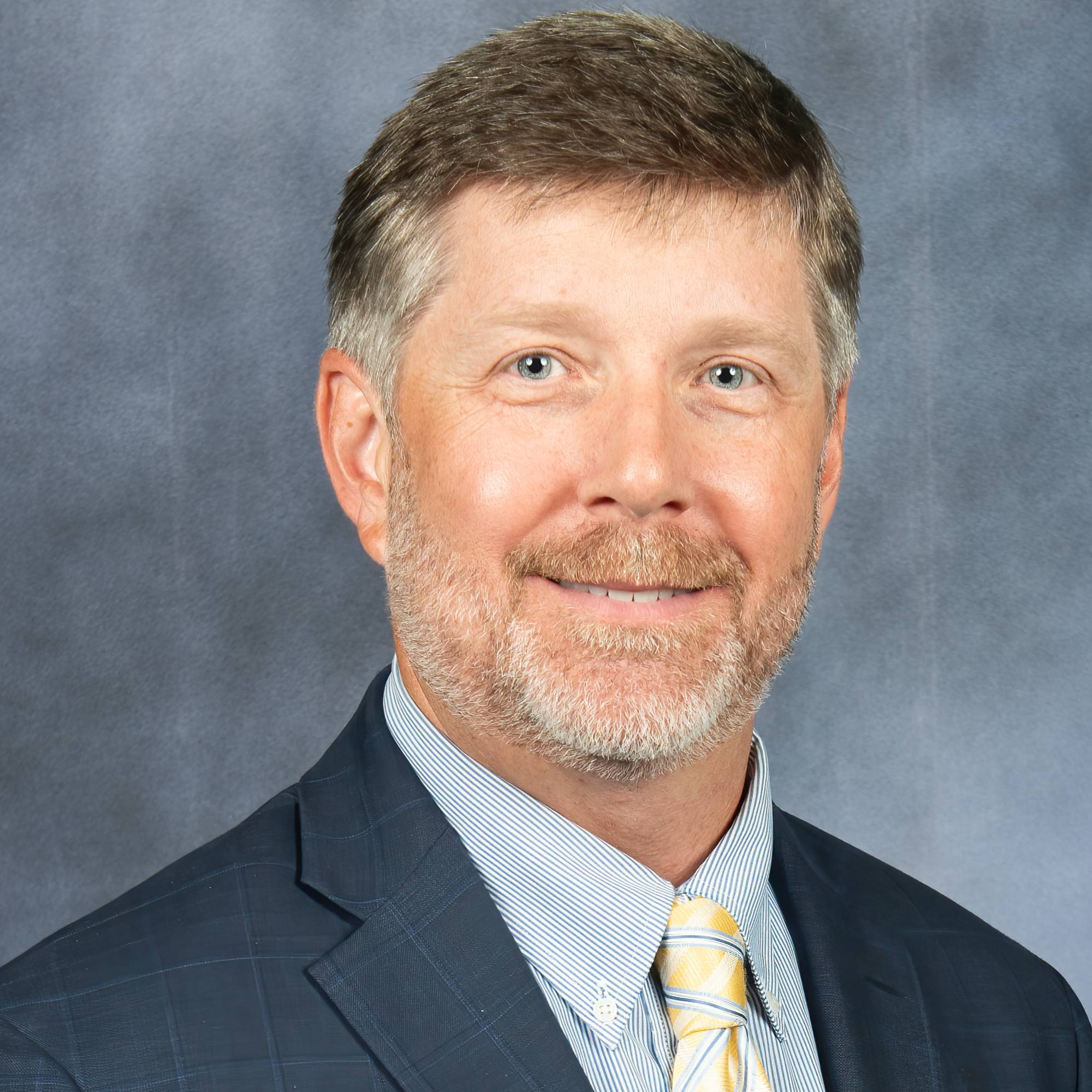 man smiling for headshot photo