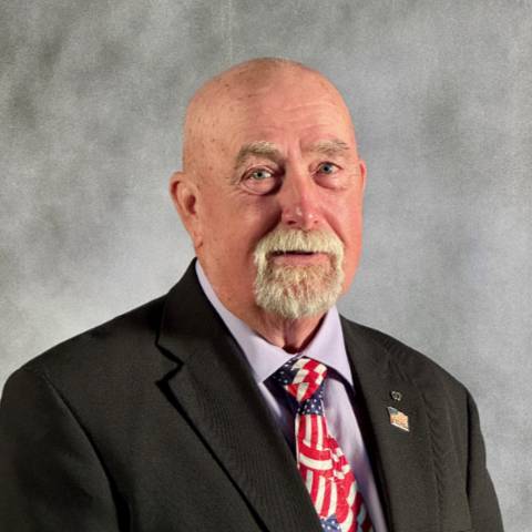 Maile in sports coat and American flag tie