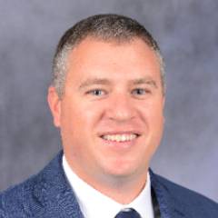man in blue suit and white shirt