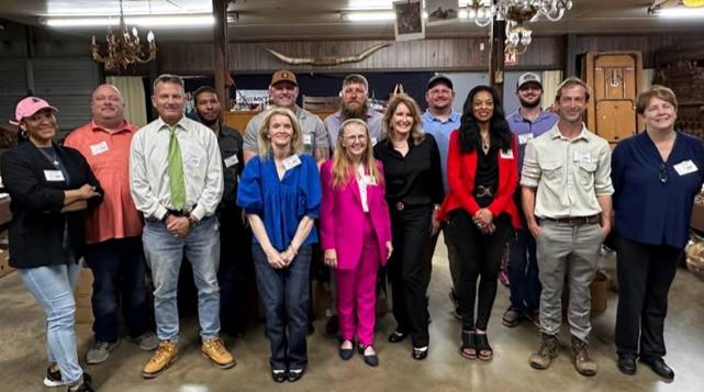 Carolina Auction Academy Students Standing Together as a Group Following Charity Auction
