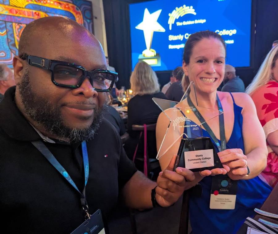 man and woman holding award