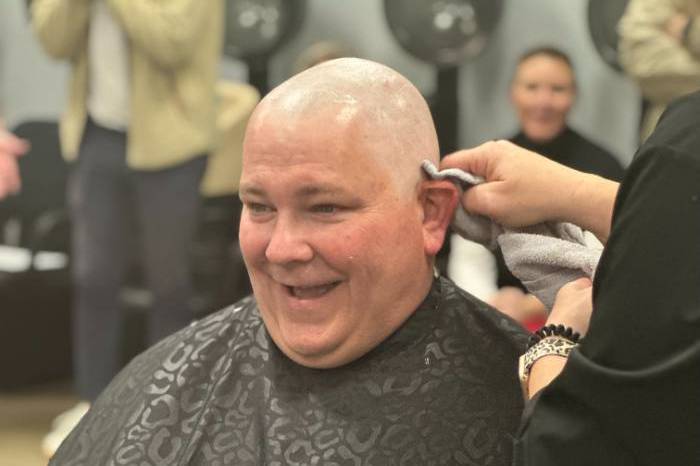 Man having his head shaved