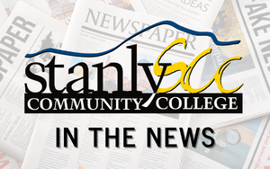 SCC logo and the words "In the News" with Newspapers in the background