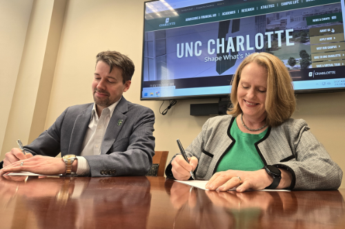 UNC Charlotte officials signing OnRamp agreement