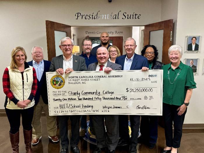 SCC Trustees holding a ceremonial check with NC Representative